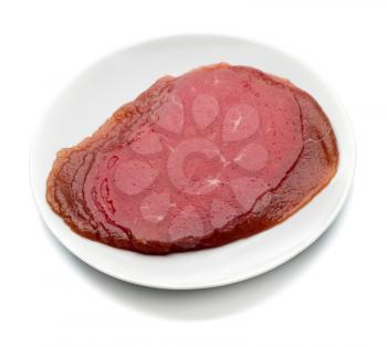 Appetizing smoked meat on the plate. Isolate on white.