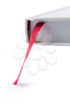 Book with red bookmark at the beginning of the volume. Isolate on white.