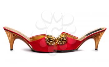 Pair red female shoe with gold brooch. Isolate on white.