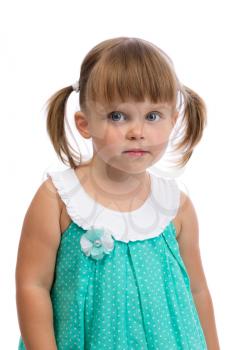 Portrait of a little three year old charming girl in the studio on a white background. Isolate on white.