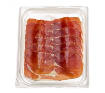 Apetitnye slices of ham in a plastic transparent blister. Isolate on white.