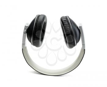 Black leather headphones upside down. Isolate on white background in studio.