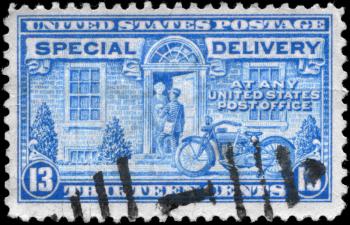 Royalty Free Photo of a 1944 US Stamp of a Postman and Motorcycle