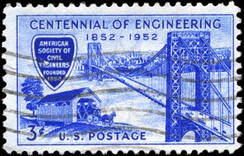 Royalty Free Photo of 1952 US Stamp Shows George Washington Bridge and Covered Bridge of 1850s, Engineering Centennial Issue