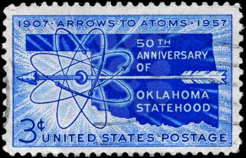 Royalty Free Photo of 1957 US Stamp Shows the Map, Arrow and Atom Diagram, Oklahoma Statehood, 50th Anniversary