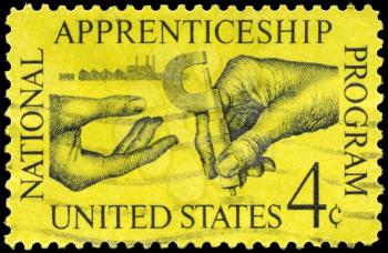Royalty Free Photo of 1962 US Stamp Shows the Machinist Handing Micrometer to Apprentice, Apprenticeship Issue