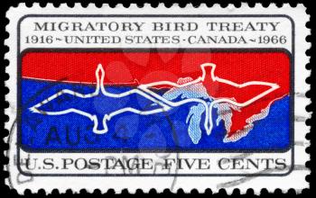 Royalty Free Photo of 1966 US Stamp Shows the Migratory Birds Over Canada-US Border