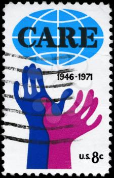 Royalty Free Photo of 1971 US Stamp Shows Hands Reaching for Care, 25th Anniversary of CARE