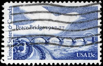 Royalty Free Photo of 1977 US Stamp Shows Peace Bridge and Dove, 50th Anniversary