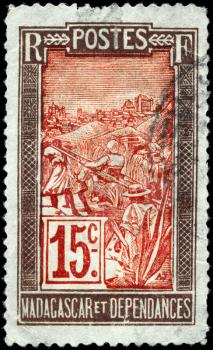 MADAGASCAR - CIRCA 1916: A Stamp printed in MADAGASCAR shows the Transportation by Sedan Chair, circa 1916
