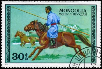 MONGOLIA - CIRCA 1977: A Stamp printed in MONGOLIA shows the image of the Hunter on Horseback, series, circa 1977