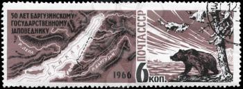USSR - CIRCA 1966: A Stamp printed in USSR shows the Map of Lake Baikal region and Game Reserve, brown bear on lake shore, series, circa 1966