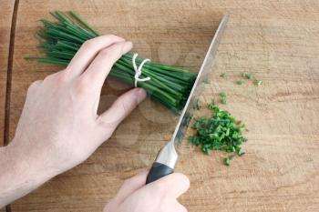 Royalty Free Photo of a Person Cutting Chives