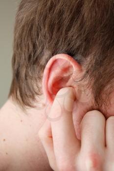 Royalty Free Photo of a Man Plugging His Ears