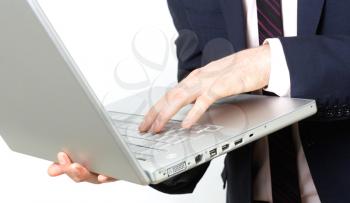 Royalty Free Photo of a Businessman Using a Laptop