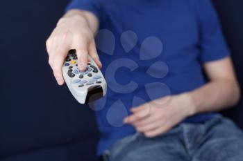 Royalty Free Photo of a Guy Holding a Remote