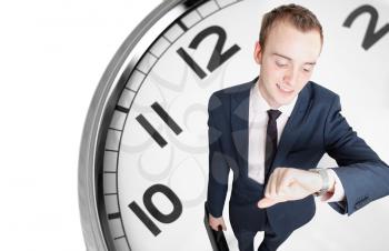 Royalty Free Photo of a Businessman by a Clock