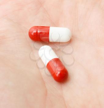 Royalty Free Photo of a Person Holding Pills