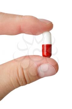 Royalty Free Photo of a Person Holding a Pill