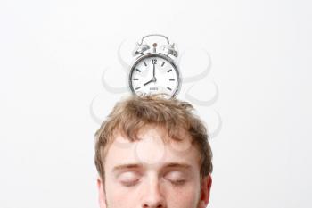 Royalty Free Photo of an Alarm Clock on a Man's Head