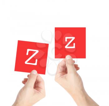 Z written on cards held by hands