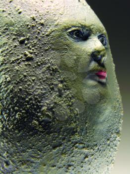 Royalty Free Photo of a Face in a Stone