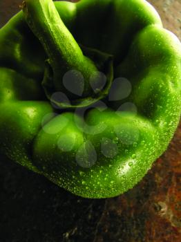 Royalty Free Photo of a Green Pepper With Water Drops