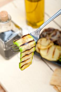 grilled zucchini courgette on a fork macro close up