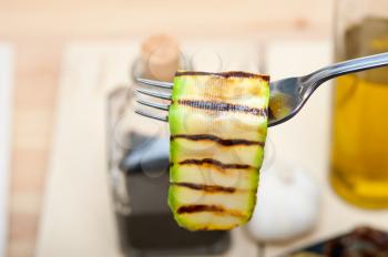 grilled zucchini courgette on a fork macro close up