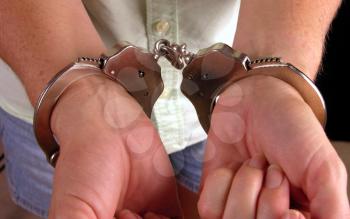 Royalty Free Photo of a Person in Handcuffs