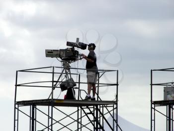 Royalty Free Photo of a TV Camera Crew Working On Scaffolding
