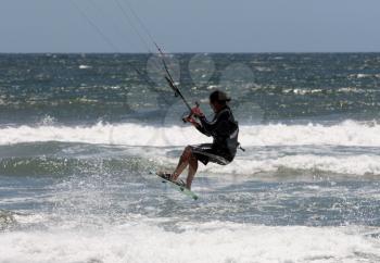 Royalty Free Photo of a Person Kite Surfing