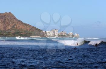 Royalty Free Photo of People Surfing in Hawaii