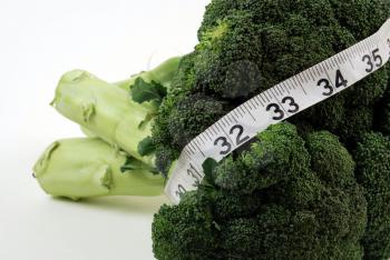 Royalty Free Photo of Broccoli and Measuring Tape