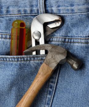 Royalty Free Photo of Tools in a Jean Pocket