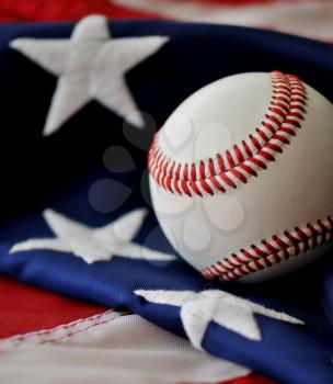 Royalty Free Photo of a Baseball on an American Flag