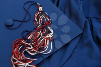 Royalty Free Photo of a Cap and Gown With Tassel