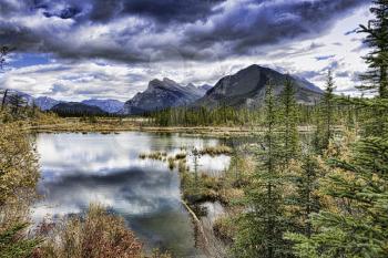 A view across Vermilion Lakes towards Mount Rundle and the town of Banff. Banff National Park, Alberta, Canada.