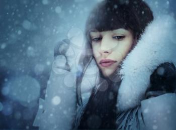 Snowfall. Abstract female portrait with beauty bokeh