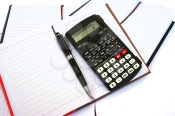 Royalty Free Photo of a Calculator on a Notebook