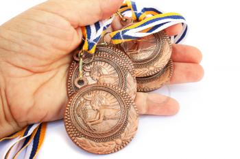 Royalty Free Photo of a Person Holding Medals