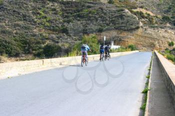 Royalty Free Photo of a Mountain Bikers on a Road