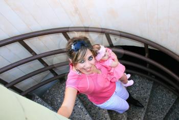Royalty Free Photo of a Mother and Daughter Climbing Stairs