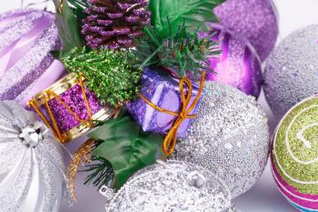 Christmas decoration with balls, cone, gift box closeup picture.