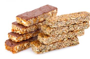 Muesli bars with different nuts and seeds isolated on white background.