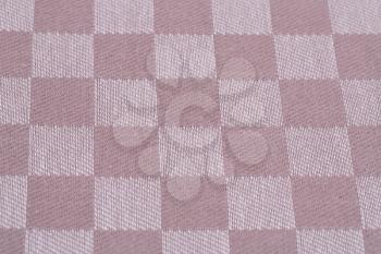 Checkered tablecloth texture as a background, closeup picture.