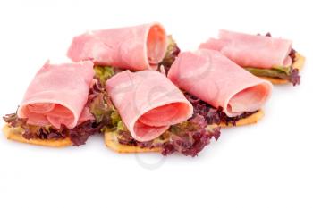 Sandwiches with crackers, bacon and lettuce isolated on white background.