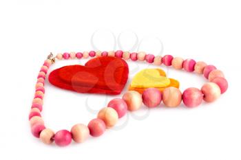 Colorful hearts and wooden necklace on white background.