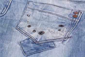 Blue jeans pocket closeup picture.