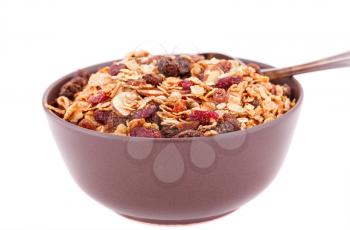 Muesli in the bowl isolated on white background.